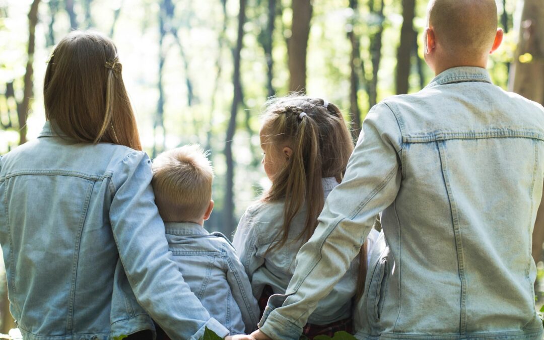 Family sitting in a forest